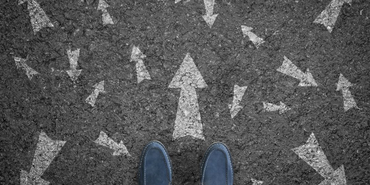 shoes and arrows on pavement